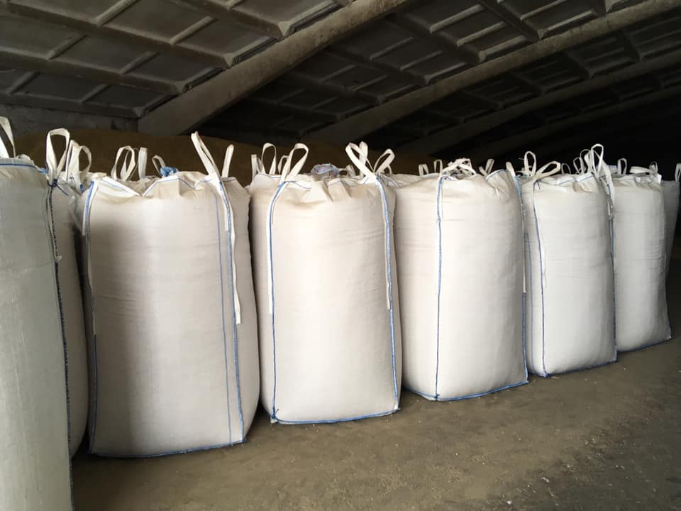 Rows of large bulk bags stored in a warehouse Rows of large bulk bags stored in a warehouse